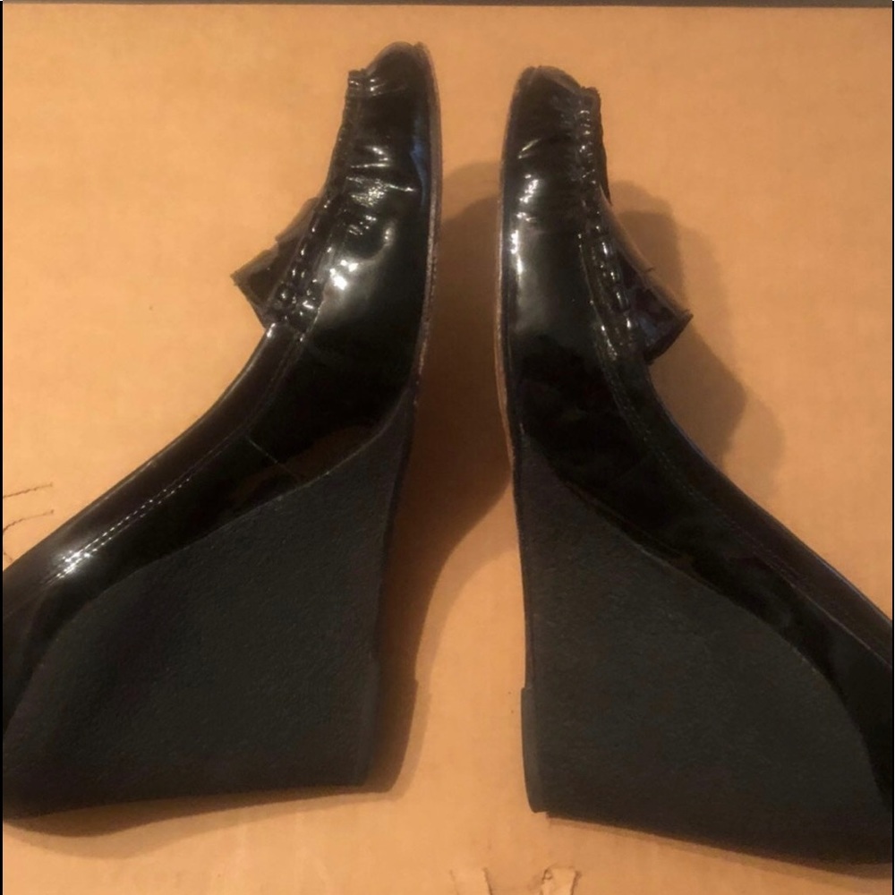 Black Wedge Heels left shoe is a 8 1/2 and the right is a 8